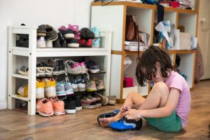 Putting Away Shoes preschooler